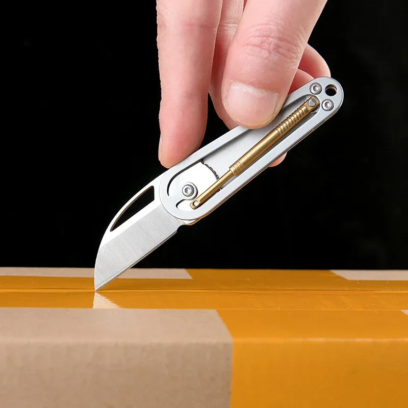 Swing arm folding knife